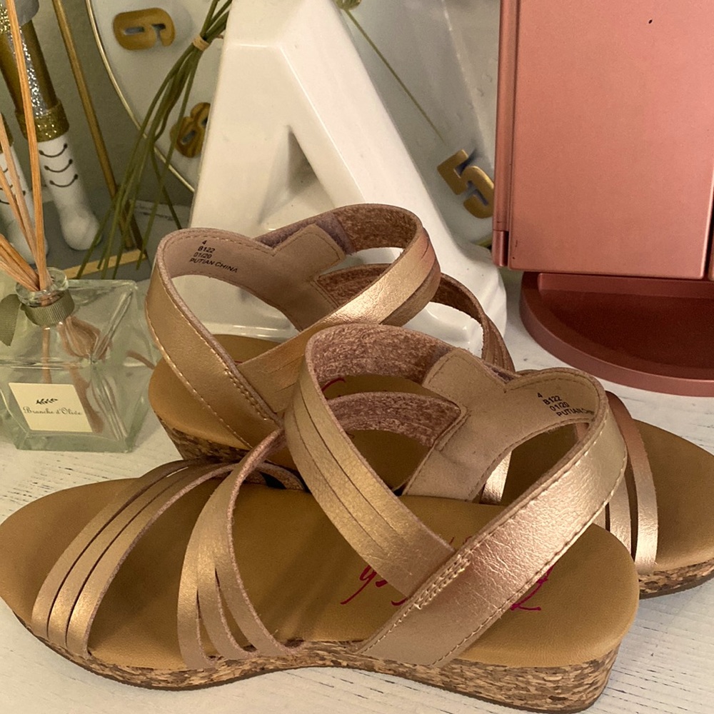 These are brand new rose gold and brown wedges.